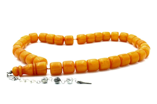 Close-up image of a wooden Tasbeeh with 99 beads, commonly used in Islamic prayer and meditation