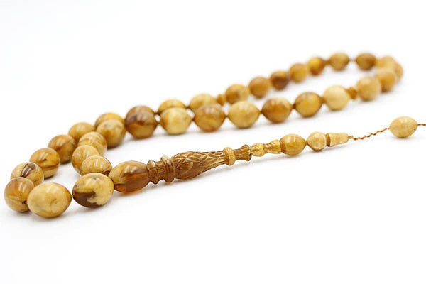 Close-up image of a wooden Tasbih with 99 beads, commonly used for Muslim prayer and meditation